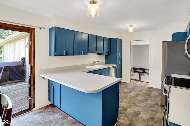 1328 E 600 N, West Lafayette, IN 47906 - kitchen with blue cabinets, dishwasher, light countertops, a peninsula, and range