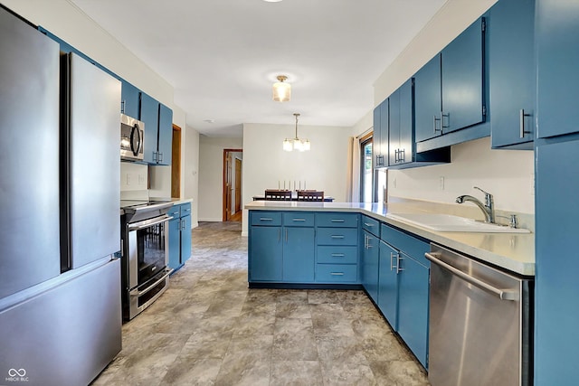 1328 E 600 N, West Lafayette, IN 47906 - kitchen with stainless steel appliances, blue cabinets, and a peninsula