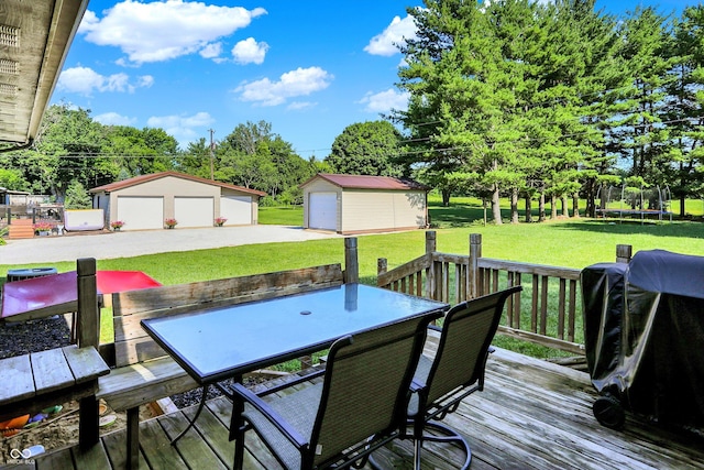 1328 E 600 N, West Lafayette, IN 47906 - wooden deck with outdoor dining area, an outdoor structure, a trampoline, a garage, and a yard