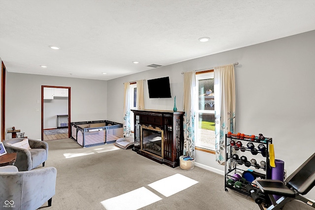 1328 E 600 N, West Lafayette, IN 47906 - carpeted living room featuring a glass covered fireplace and recessed lighting