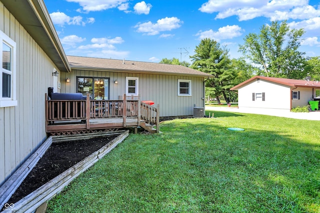 1328 E 600 N, West Lafayette, IN 47906 - back of property with a lawn, a deck, a shingled roof, and board and batten siding