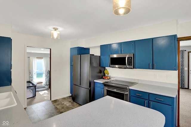 1328 E 600 N, West Lafayette, IN 47906 - kitchen featuring stainless steel appliances, blue cabinets, and light countertops