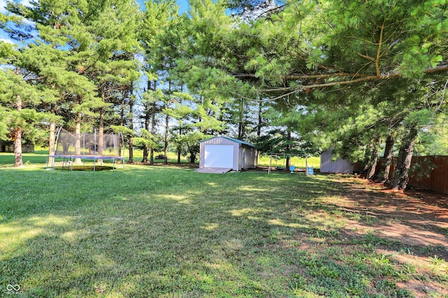 1328 E 600 N, West Lafayette, IN 47906 - view of yard with a trampoline, a detached garage, and a shed