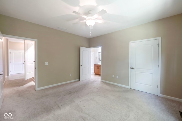471 Harvest Moon Dr, Greencastle, IN 46135 - unfurnished bedroom featuring light carpet, ceiling fan, and connected bathroom