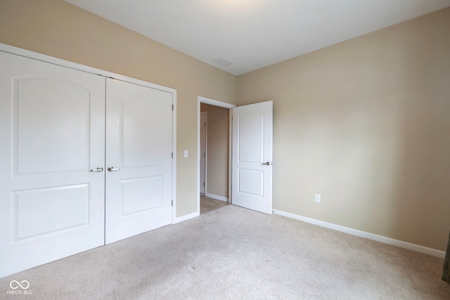 471 Harvest Moon Dr, Greencastle, IN 46135 - unfurnished bedroom featuring light colored carpet and a closet