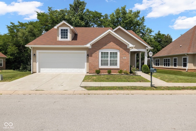 471 Harvest Moon Dr, Greencastle, IN 46135 - view of front of home with a front yard, driveway, brick siding, and a garage