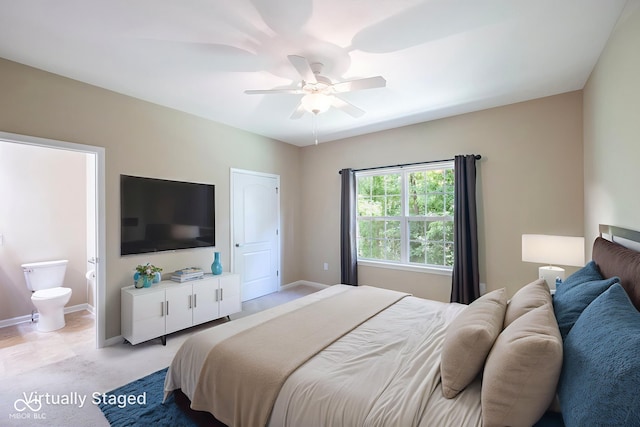 471 Harvest Moon Dr, Greencastle, IN 46135 - bedroom with light colored carpet, ensuite bath, and a ceiling fan