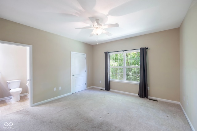 471 Harvest Moon Dr, Greencastle, IN 46135 - unfurnished bedroom featuring carpet floors, connected bathroom, and a ceiling fan