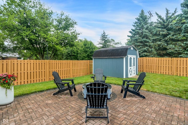 17101 Rushmore Dr, Westfield, IN 46074 - fenced backyard with a fire pit, a patio, and a storage shed