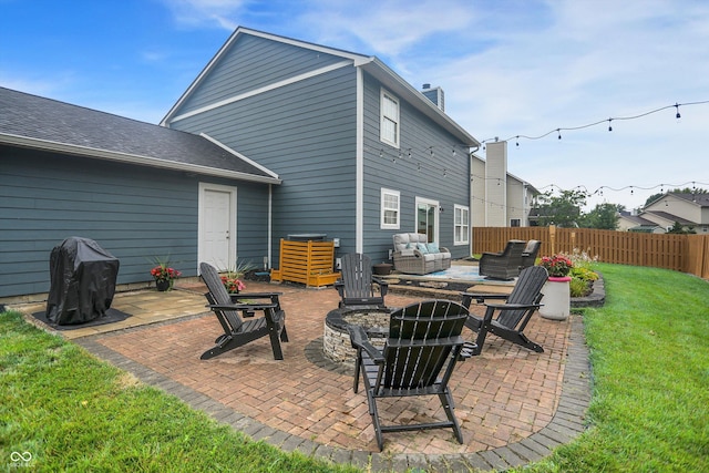 17101 Rushmore Dr, Westfield, IN 46074 - back of property with an outdoor living space with a fire pit, a patio, and a chimney