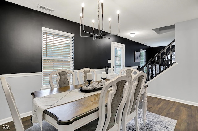 17101 Rushmore Dr, Westfield, IN 46074 - dining room with a chandelier, wood finished floors, healthy amount of natural light, and stairway