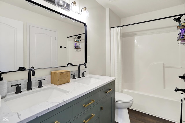 17101 Rushmore Dr, Westfield, IN 46074 - bathroom with double vanity, shower / bath combo with shower curtain, and wood finished floors
