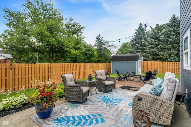 17101 Rushmore Dr, Westfield, IN 46074 - fenced backyard featuring a storage shed, a patio, and an outdoor living space with a fire pit
