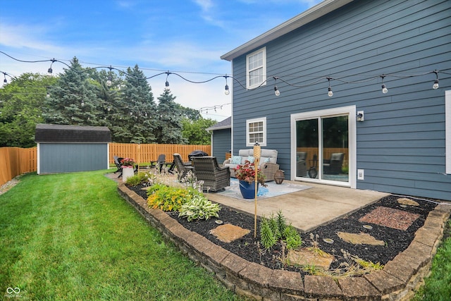 17101 Rushmore Dr, Westfield, IN 46074 - back of house featuring a patio, a fenced backyard, outdoor lounge area, and a storage unit