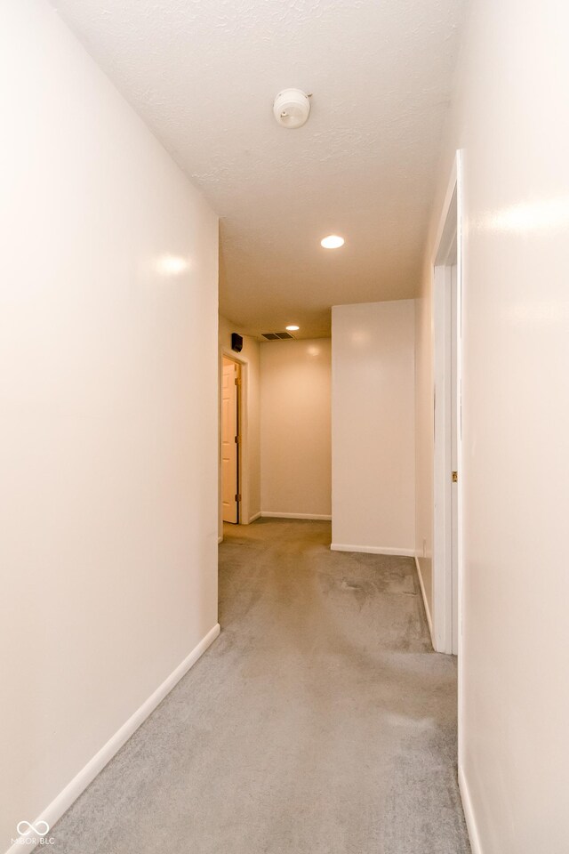 4729 Hittle Dr, Indianapolis, IN 46239 - corridor with light carpet and recessed lighting