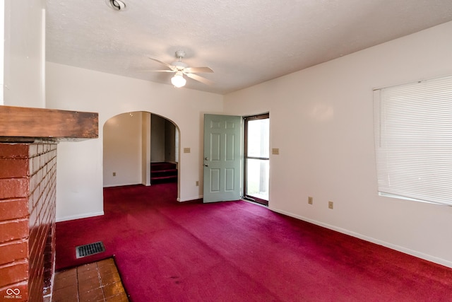 4729 Hittle Dr, Indianapolis, IN 46239 - unfurnished living room with a ceiling fan, carpet flooring, and arched walkways