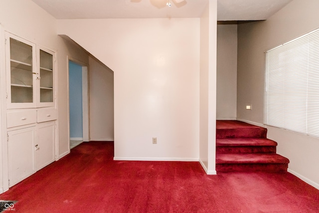 4729 Hittle Dr, Indianapolis, IN 46239 - unfurnished room featuring carpet, stairway, and ceiling fan