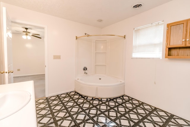 4729 Hittle Dr, Indianapolis, IN 46239 - bathroom with shower / tub combination, a ceiling fan, vanity, and tile patterned floors