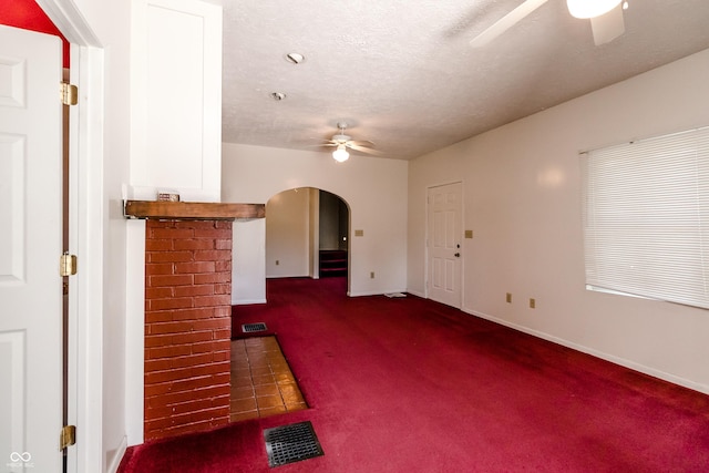 4729 Hittle Dr, Indianapolis, IN 46239 - unfurnished living room featuring a ceiling fan, carpet, and a textured ceiling