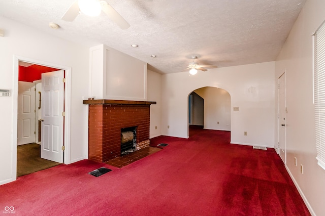 4729 Hittle Dr, Indianapolis, IN 46239 - unfurnished living room with ceiling fan, carpet, arched walkways, a fireplace, and a textured ceiling