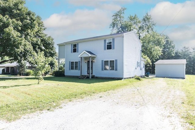 4729 Hittle Dr, Indianapolis, IN 46239 - colonial inspired home featuring a front lawn, entry steps, an outbuilding, and dirt driveway