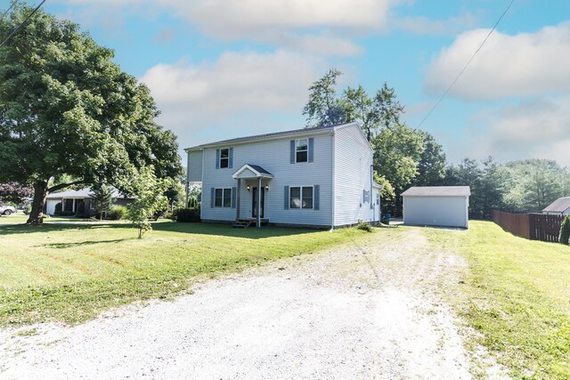 4729 Hittle Dr, Indianapolis, IN 46239 - view of front of house with driveway and a storage shed