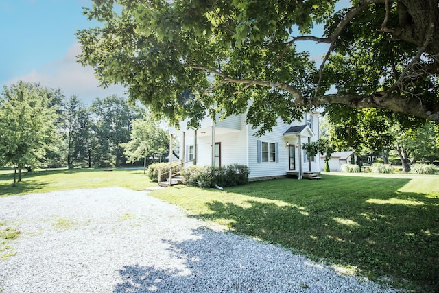 4729 Hittle Dr, Indianapolis, IN 46239 - view of home's exterior with gravel driveway and a yard