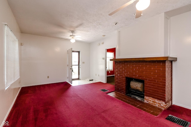 4729 Hittle Dr, Indianapolis, IN 46239 - unfurnished living room with a ceiling fan, carpet flooring, a fireplace, and a textured ceiling