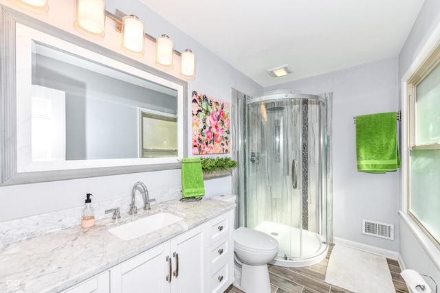 3012 Rollshore Ct, Carmel, IN 46033 - bathroom featuring vanity, a shower stall, and wood finished floors