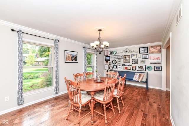 3012 Rollshore Ct, Carmel, IN 46033 - dining space with a chandelier, crown molding, plenty of natural light, and wood finished floors