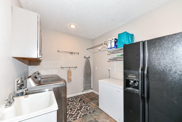 3012 Rollshore Ct, Carmel, IN 46033 - laundry room with independent washer and dryer, cabinet space, dark stone finish flooring, and recessed lighting