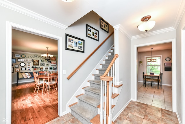 3012 Rollshore Ct, Carmel, IN 46033 - stairway with a chandelier and ornamental molding