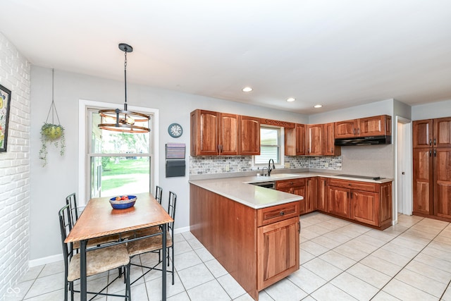 3012 Rollshore Ct, Carmel, IN 46033 - kitchen with under cabinet range hood, a peninsula, light tile patterned flooring, backsplash, and recessed lighting