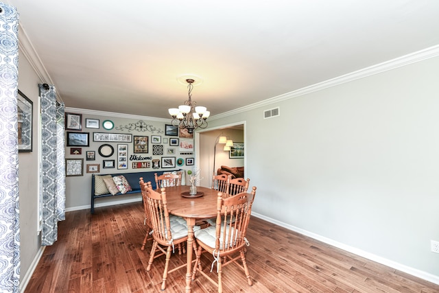 3012 Rollshore Ct, Carmel, IN 46033 - dining room featuring wood finished floors, a chandelier, and ornamental molding