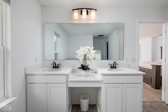 10524 Broadford St, Indianapolis, IN 46239 - bathroom with double vanity and wood finished floors