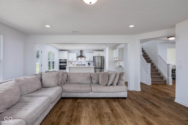 10524 Broadford St, Indianapolis, IN 46239 - living room with dark wood-style floors, stairs, and recessed lighting