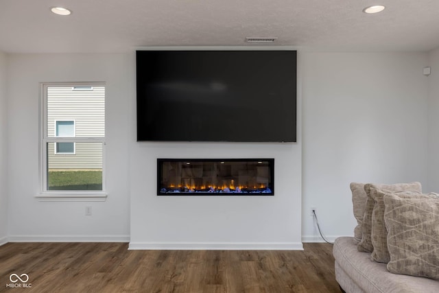 10524 Broadford St, Indianapolis, IN 46239 - detailed view of wood finished floors, a glass covered fireplace, and recessed lighting