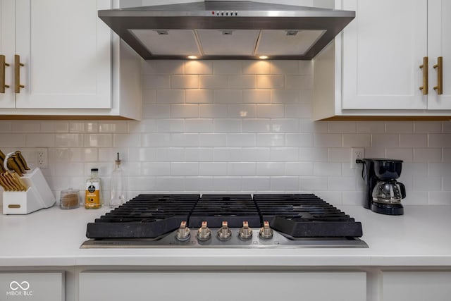 10524 Broadford St, Indianapolis, IN 46239 - kitchen with range hood, stainless steel gas stovetop, white cabinets, light countertops, and tasteful backsplash