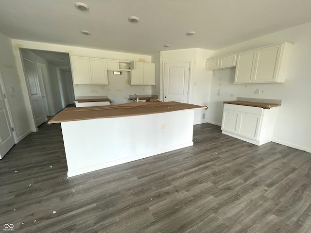 1231 Mcbride St, Greenfield, IN 46140 - kitchen featuring a kitchen island, dark wood-style flooring, and white cabinets