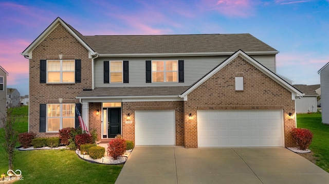 1358 Avocet Dr, Greenwood, IN 46143 - traditional home featuring driveway, a yard, brick siding, and roof with shingles