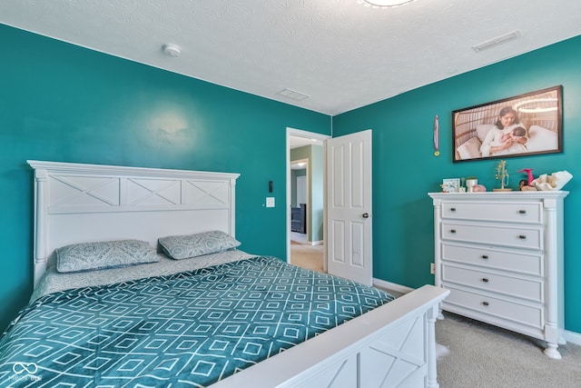 1358 Avocet Dr, Greenwood, IN 46143 - bedroom with carpet flooring and a textured ceiling