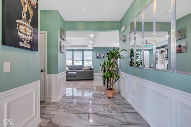 1358 Avocet Dr, Greenwood, IN 46143 - corridor with a decorative wall, a wainscoted wall, and light marble finish floors