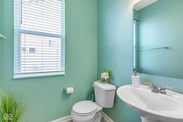 1358 Avocet Dr, Greenwood, IN 46143 - half bathroom featuring a sink and baseboards