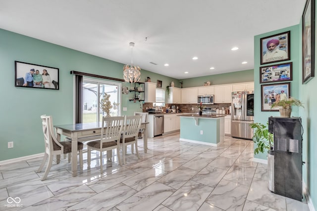 1358 Avocet Dr, Greenwood, IN 46143 - dining room featuring recessed lighting, a chandelier, and light marble finish flooring