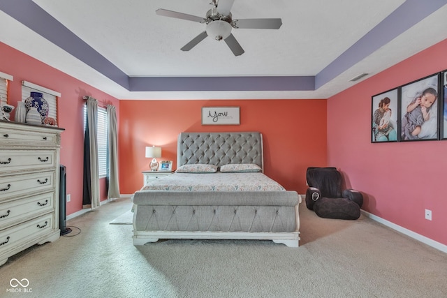 1358 Avocet Dr, Greenwood, IN 46143 - bedroom featuring carpet floors, a tray ceiling, and ceiling fan