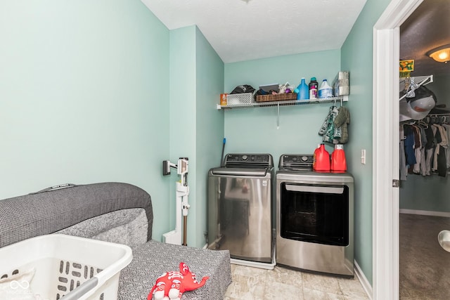 1358 Avocet Dr, Greenwood, IN 46143 - laundry room with washer and dryer and baseboards