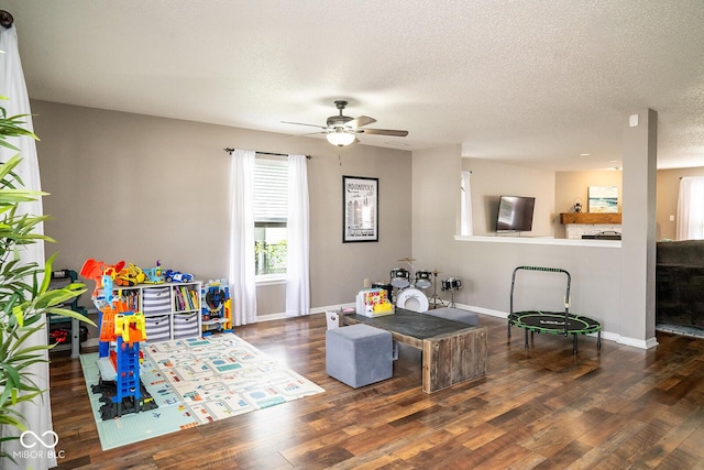 5322 Lily Pad Ln, Indianapolis, IN 46237 - living room with wood finished floors, a ceiling fan, and a textured ceiling