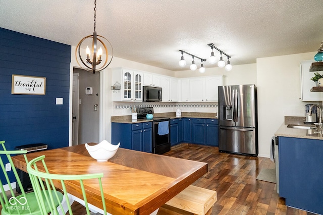 5322 Lily Pad Ln, Indianapolis, IN 46237 - kitchen featuring appliances with stainless steel finishes, blue cabinets, a chandelier, white cabinetry, and dark wood-type flooring