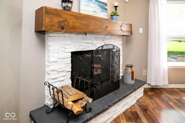 5322 Lily Pad Ln, Indianapolis, IN 46237 - detailed view of a stone fireplace and wood finished floors