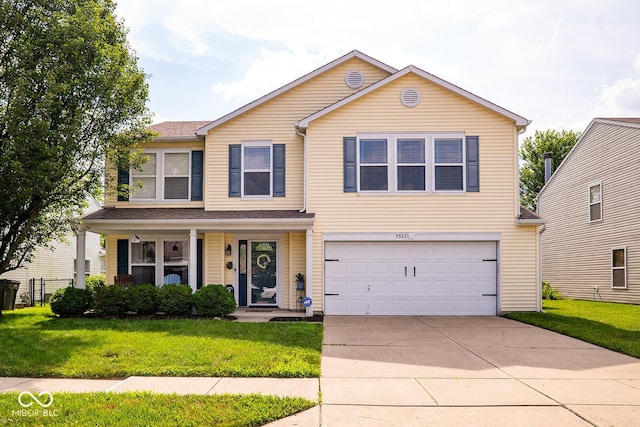 5322 Lily Pad Ln, Indianapolis, IN 46237 - traditional home featuring a front yard, concrete driveway, a garage, and covered porch